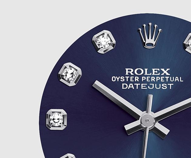 The fprominent watches fake Rolex Pearlmaster 34 81159 have blue dials, diamond hour marks and date windows.