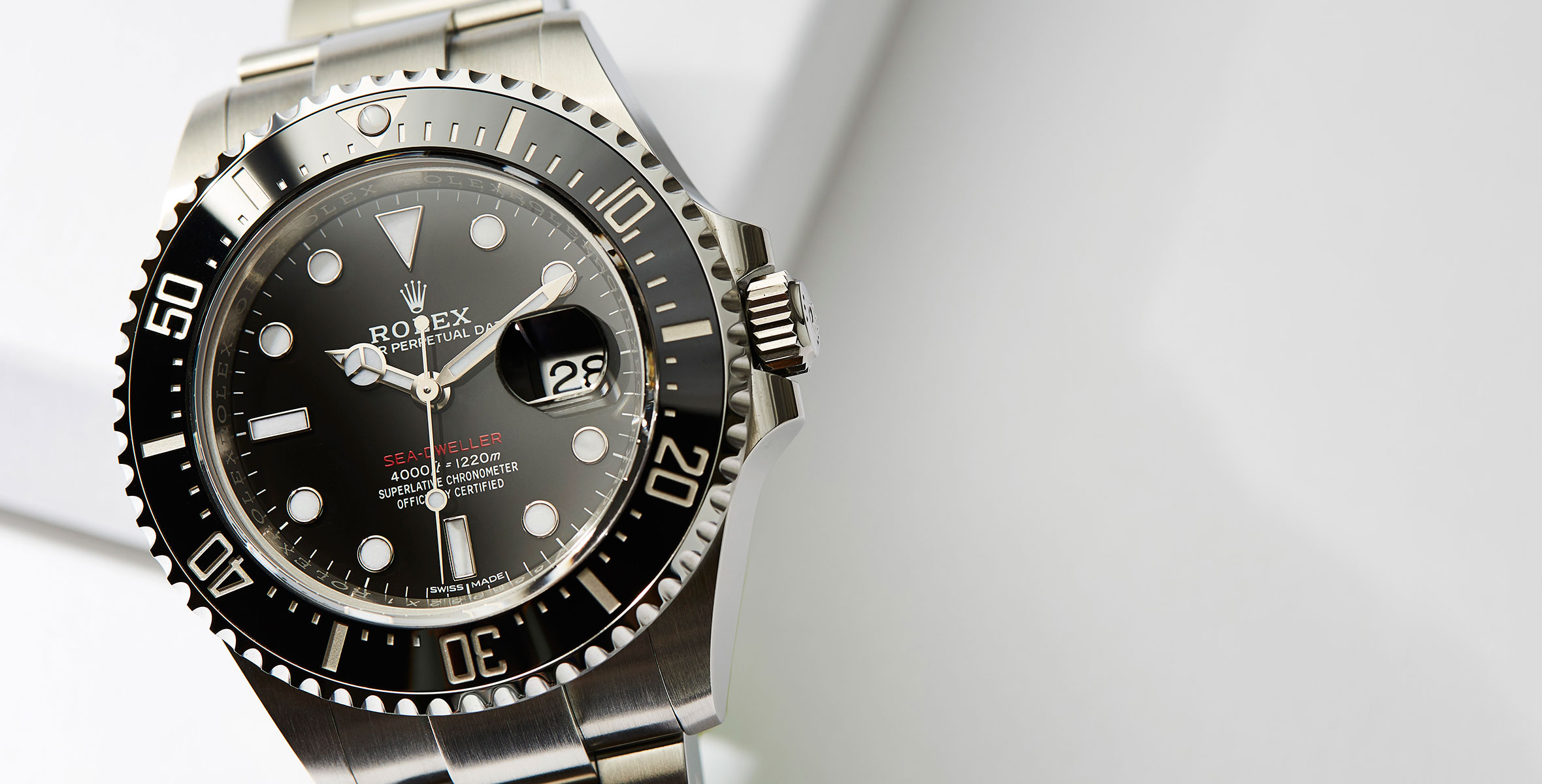 The 43 mm replica Rolex Sea-Dweller 126600 watches have black dials.