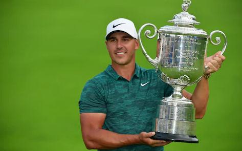 Brooks Koepka wears the popular copy Rolex Sky-Dweller 326935 watch.